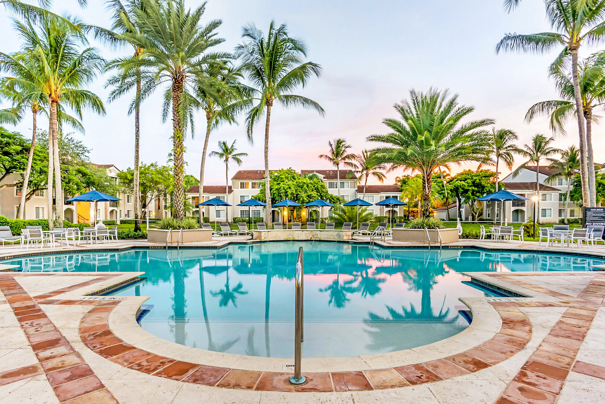 Spacious, resort-style pool with sundeck to relax
