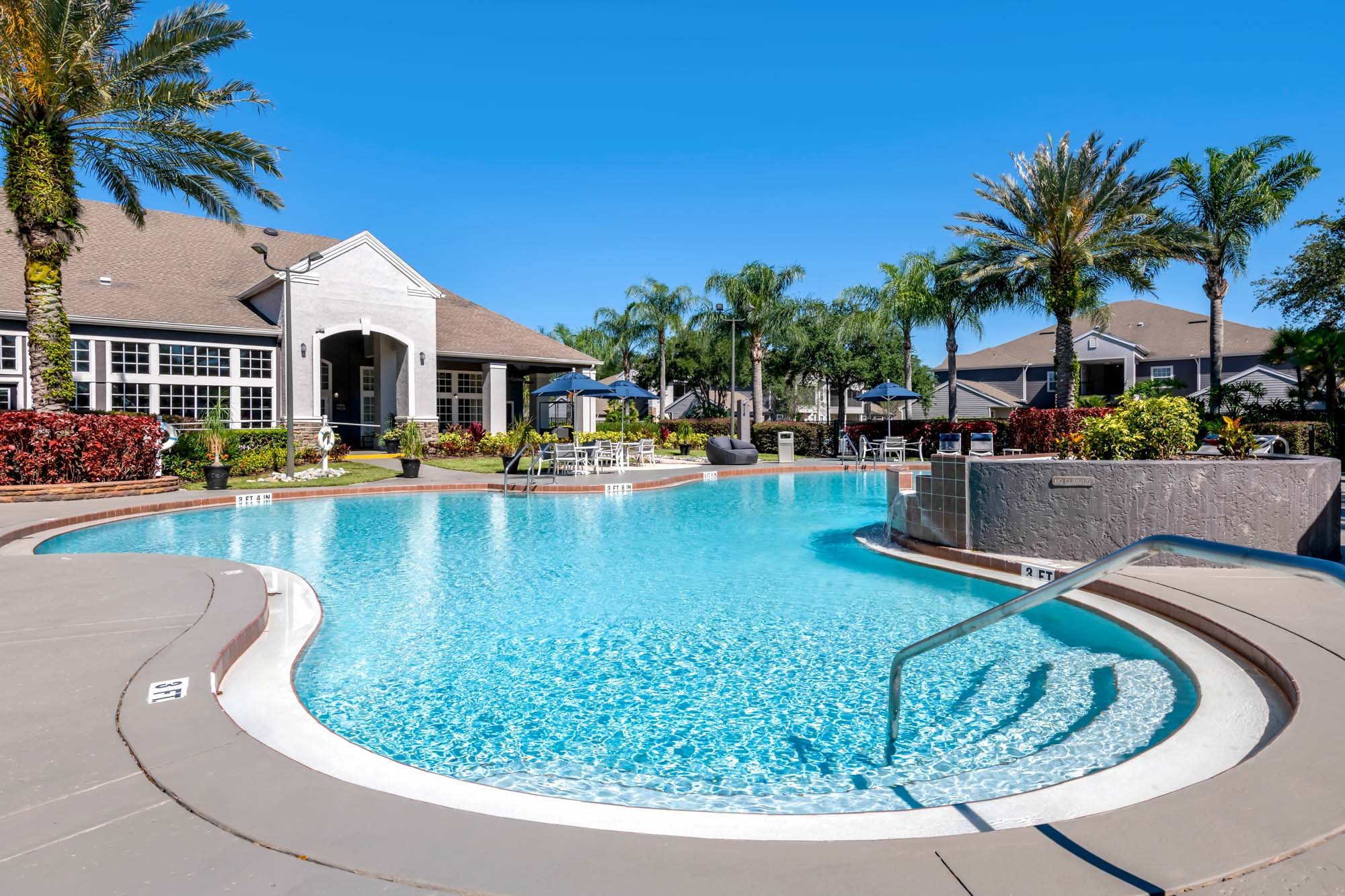 A resort-style pool at Osprey Links at Hunter's Creek apartments in Orlando, Florida.