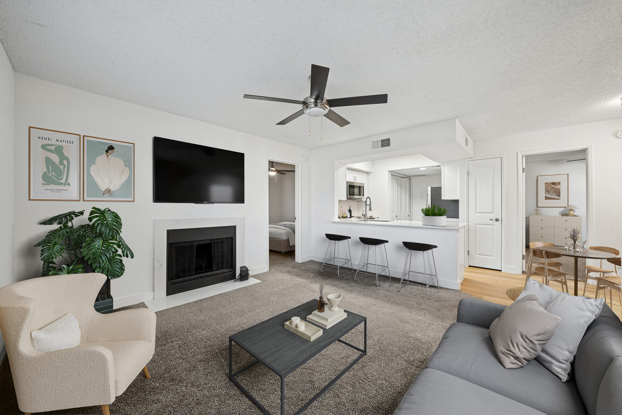 living and dining room with furniture and ceiling fan.