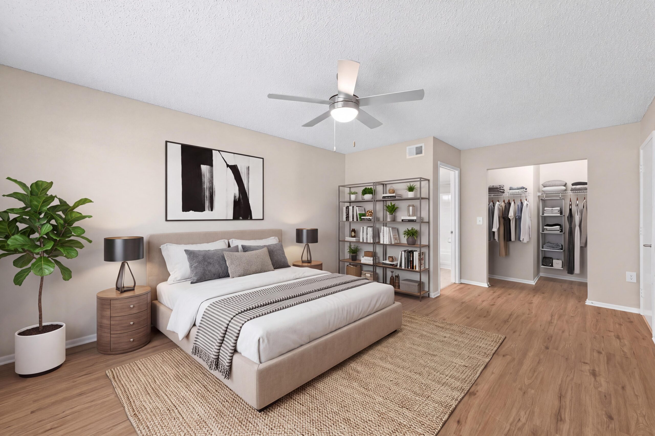 Spacious bedroom with plank flooring and ample closet space