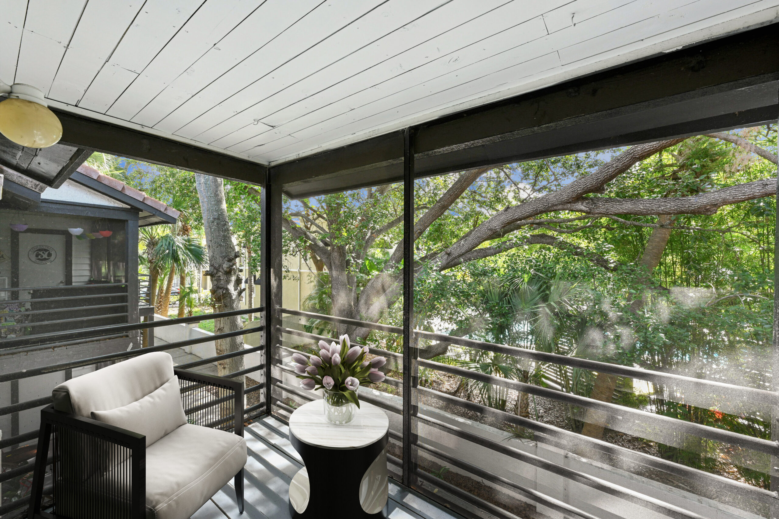 Spacious outdoor patio with net covering with patio furniture