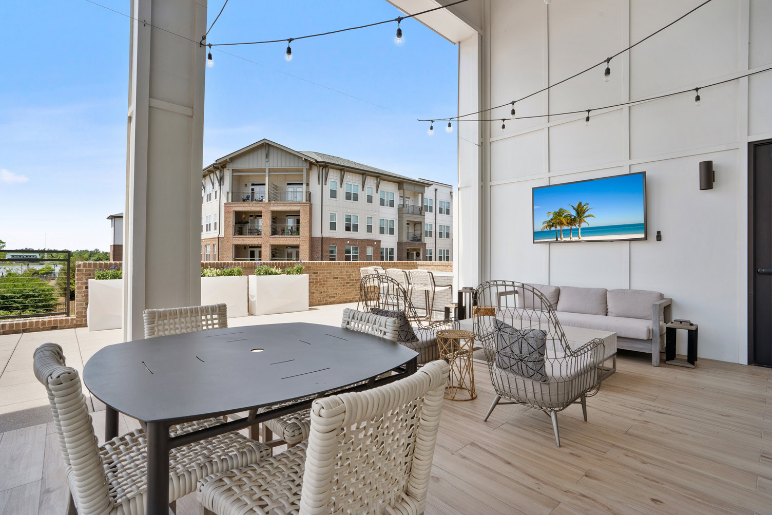 Outdoor patio with TV and seating