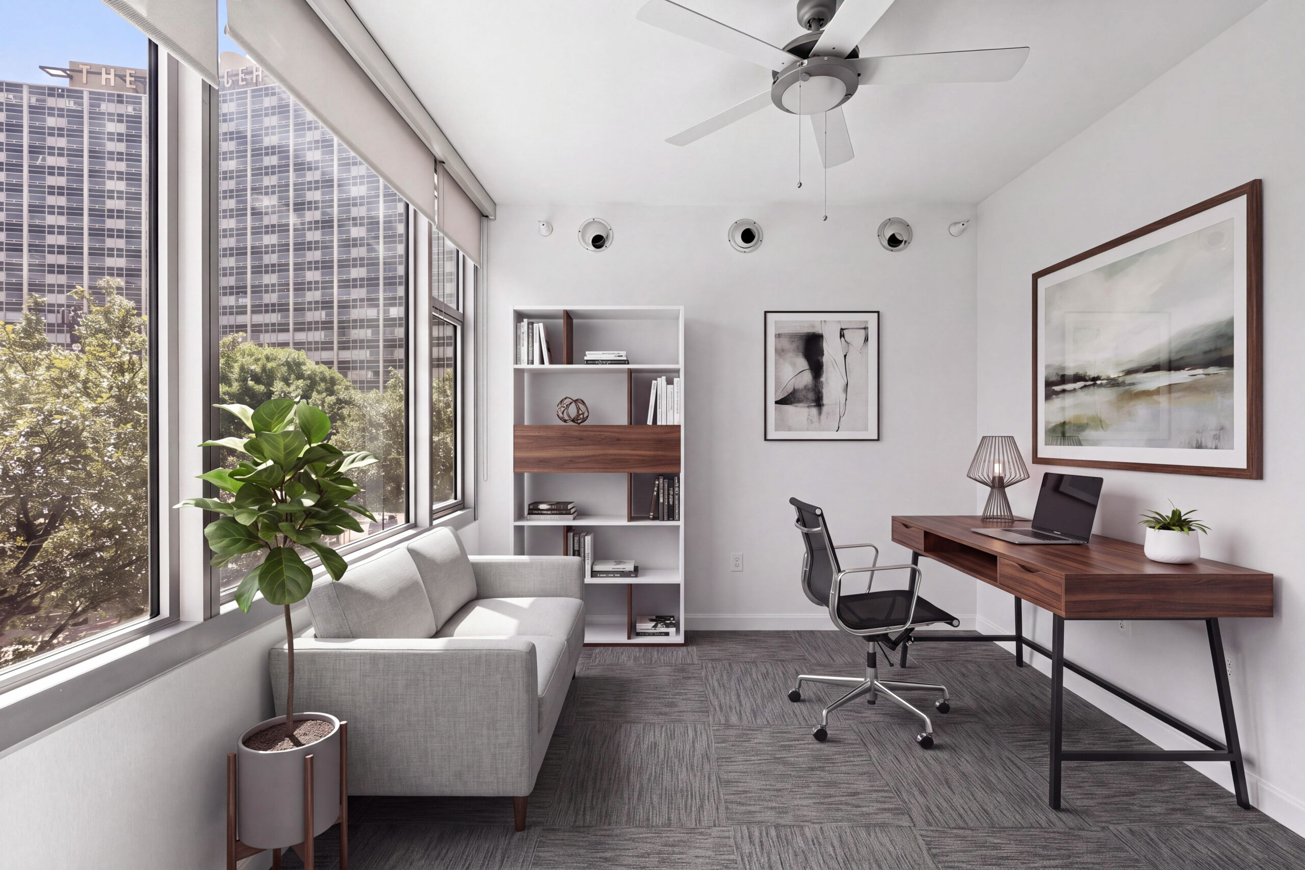 Bright home office with a desk, seating area, shelving, ceiling fan and oversized windows overlooking downtown Dallas.