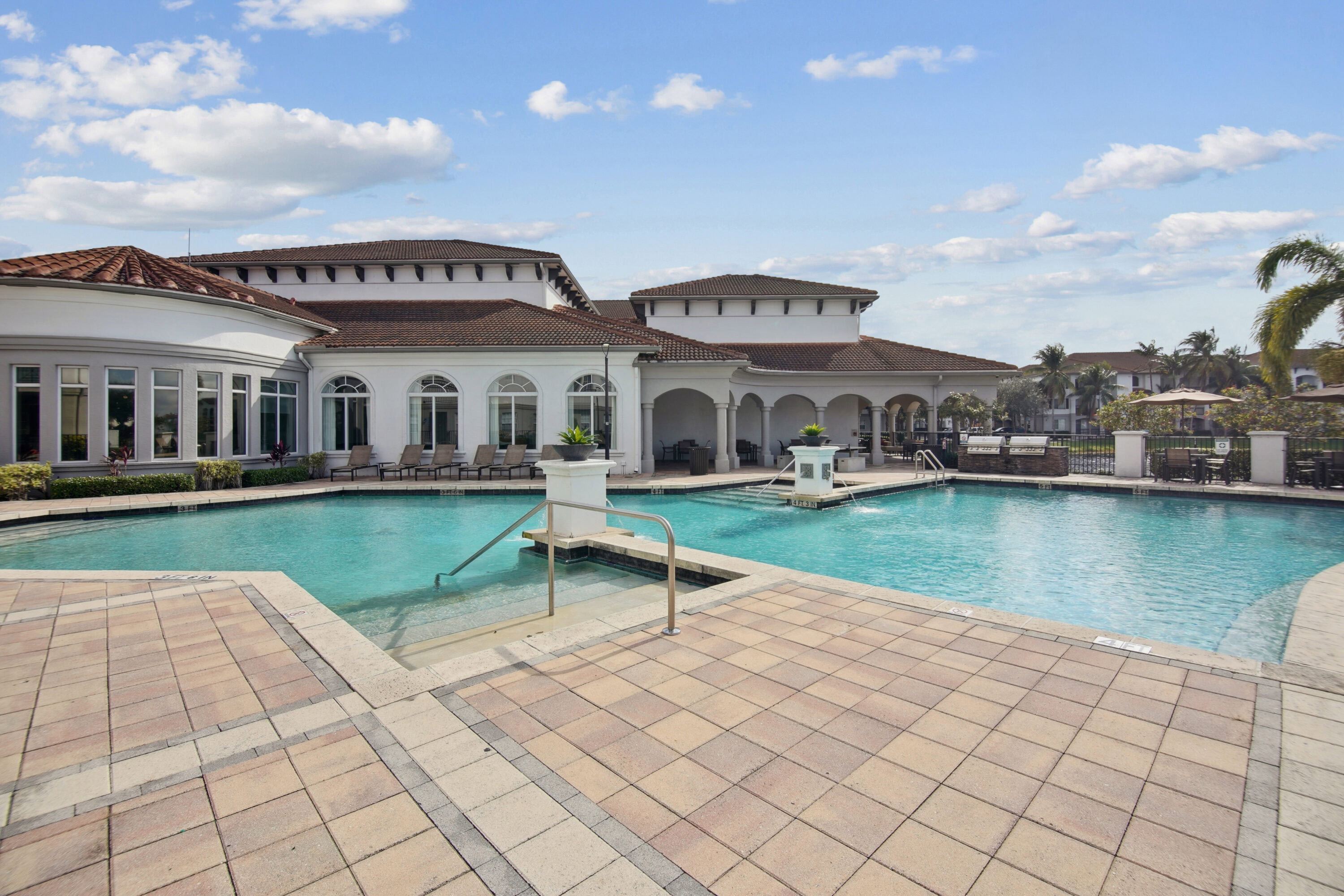 Outdoor pool with sundeck and lounge seating