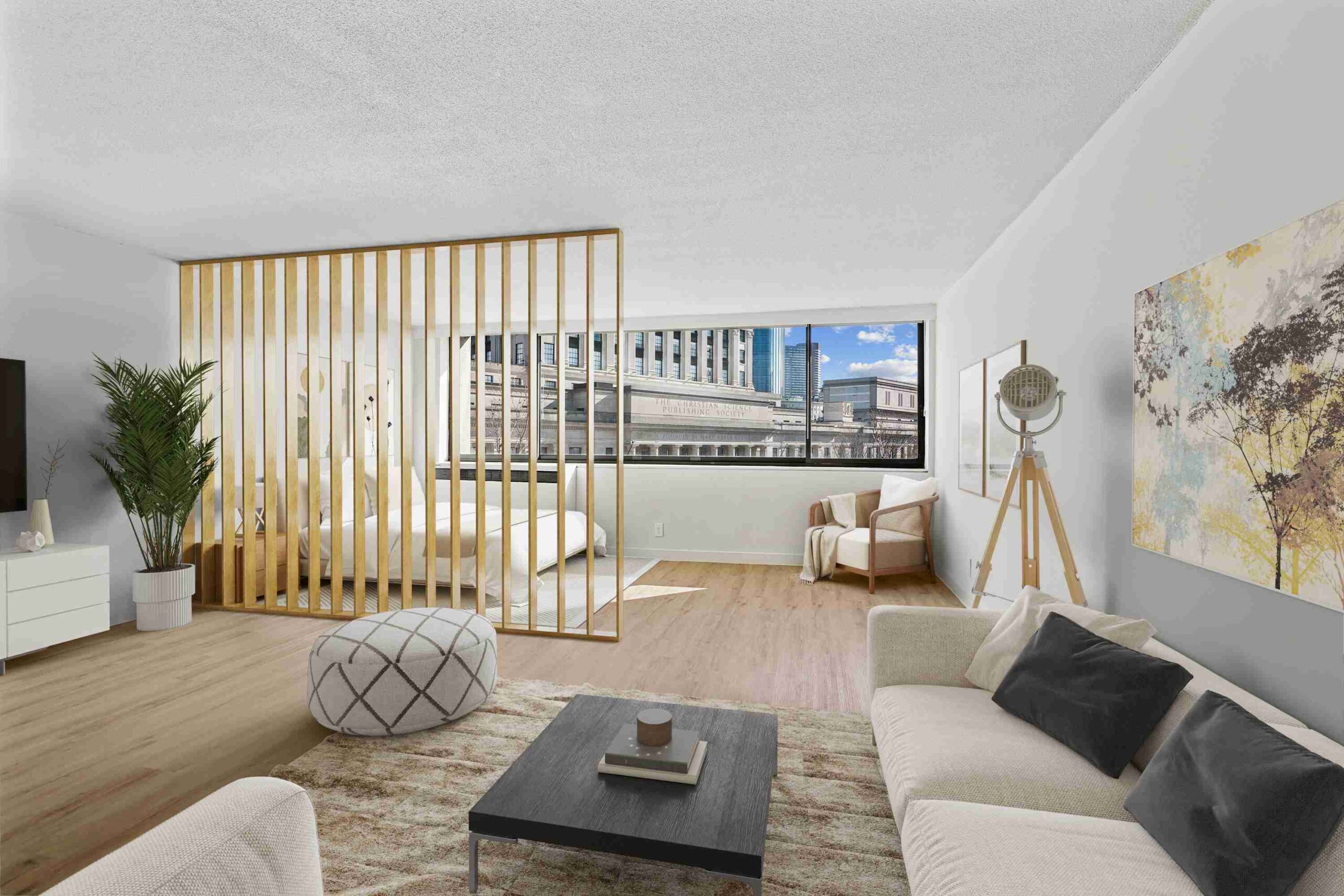Spacious apartment living room with flex space set up as an extra bedroom. Large window bringing in natural light