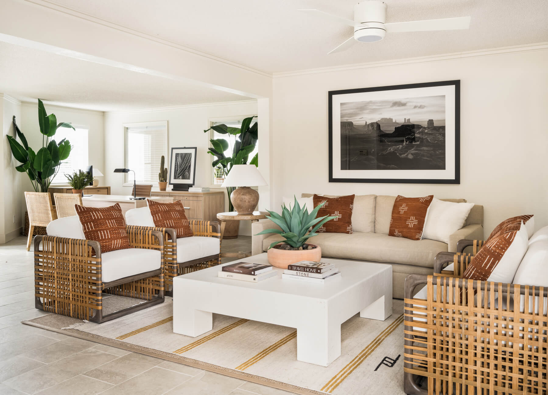 Meadow Glen Clubhouse with wicker furniture and coffee table in lounge.