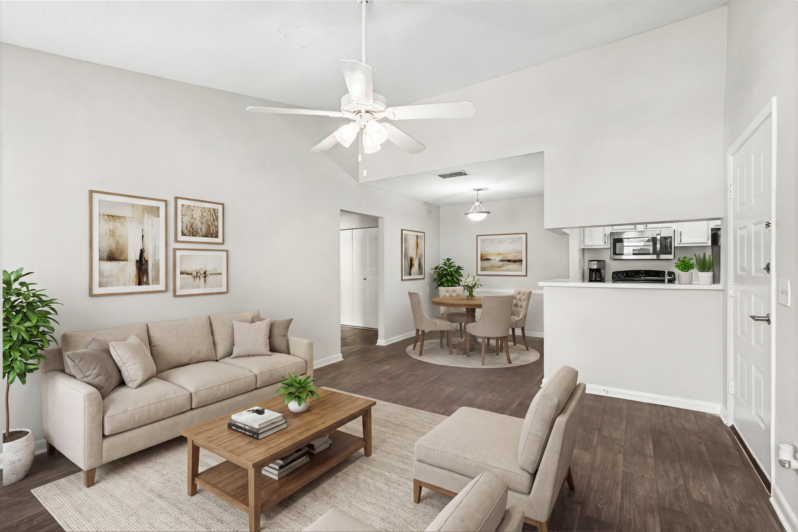 Millbrook spacious living and dining room with hardwood plank flooring, stainless steel appliances, ceiling fan, and more!