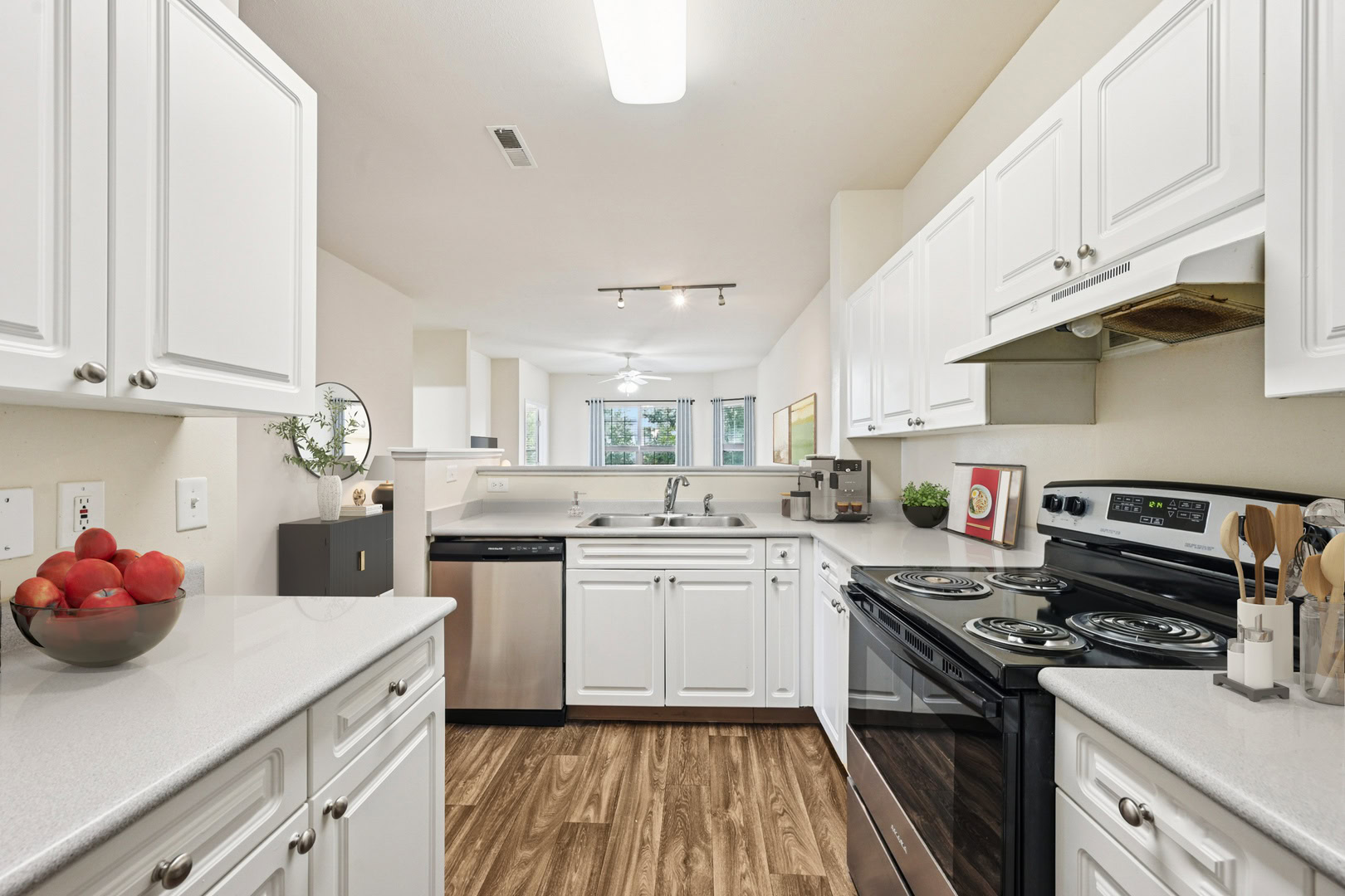 Modern, spacious kitchen with stainless steel appliances and custom cabinetry