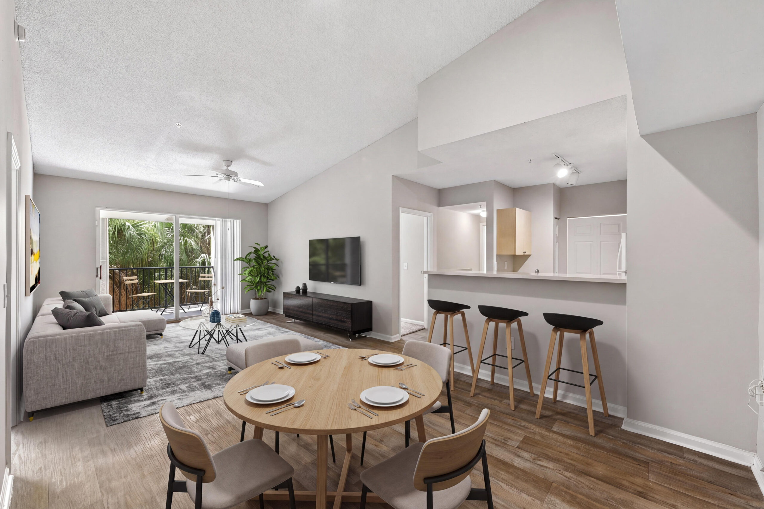 Bright living room with natural lighting and balcony