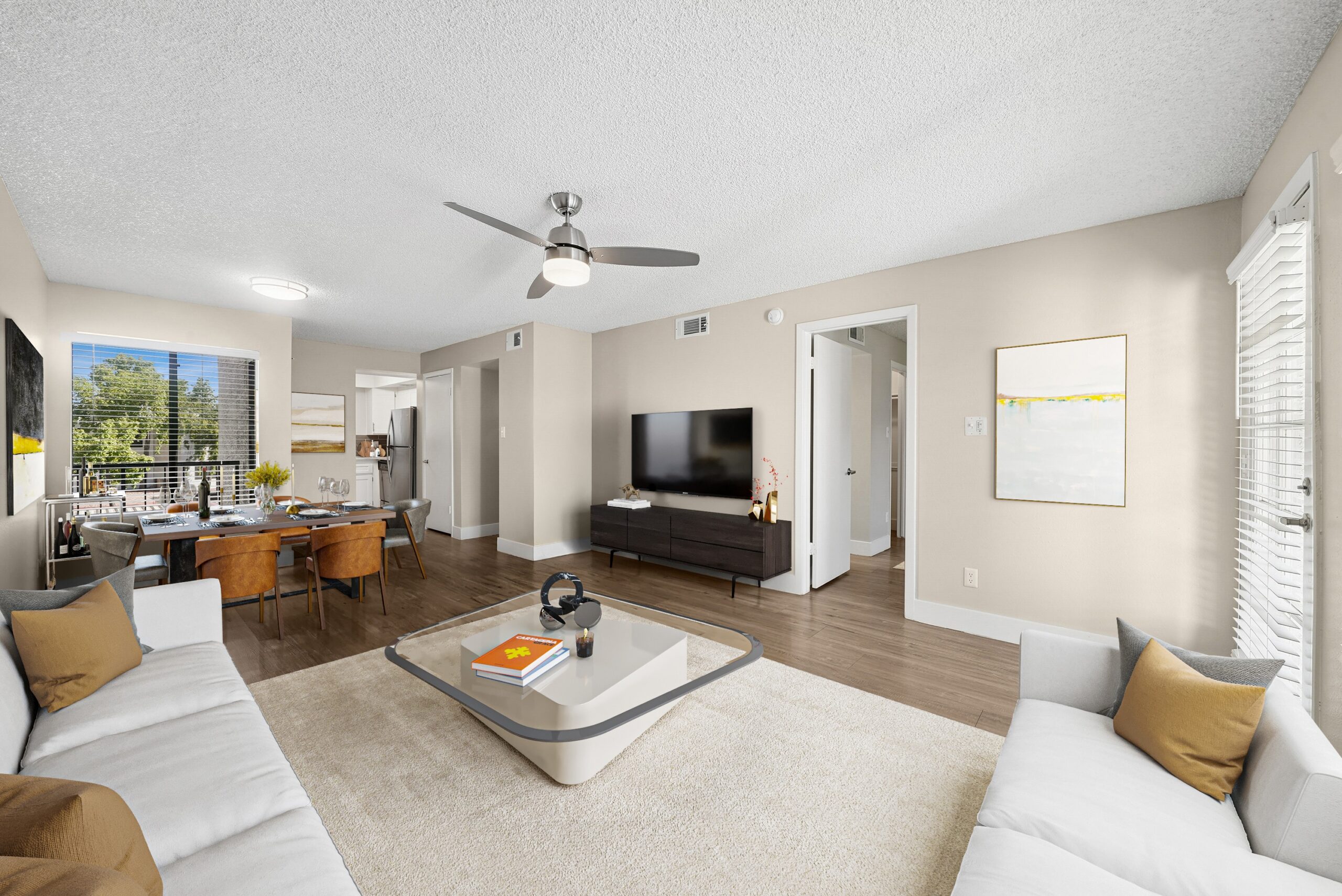Arches at Hidden Creek living room with furniture, ceiling fan.